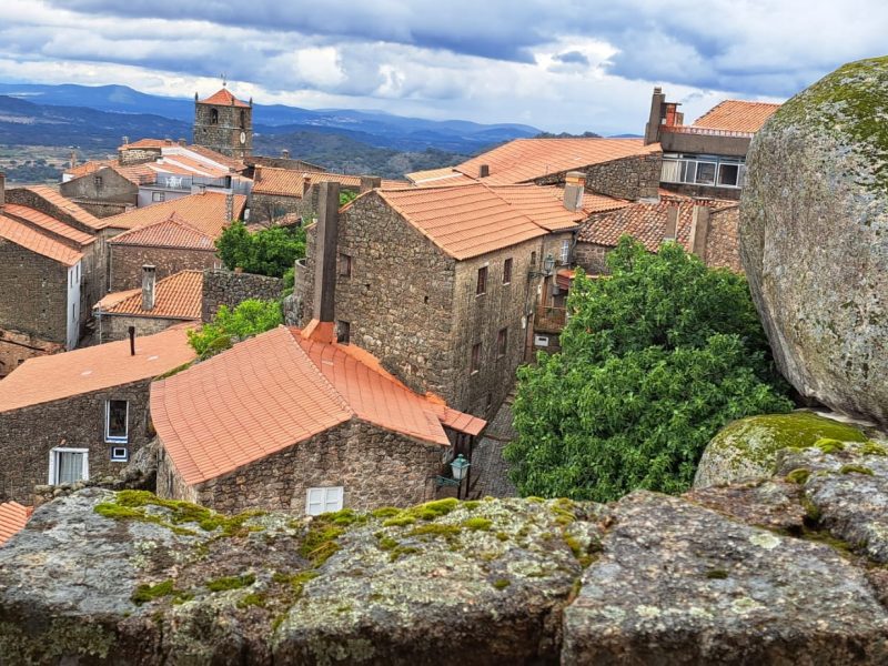 View over the stone village of Monsanto Portugal with granite houses, castle ruins and mountain landscape
